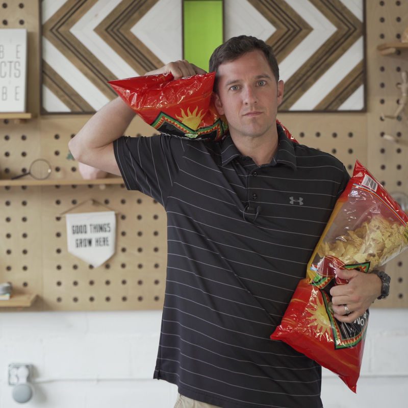 John Hawley, deadpan, with a family-size bag of chips on each shoulder